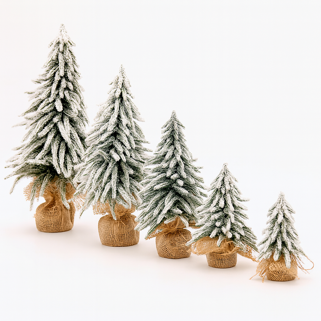 Set of small frosted mini Christmas trees with snowy branches and burlap bases arranged in a row on a white background.